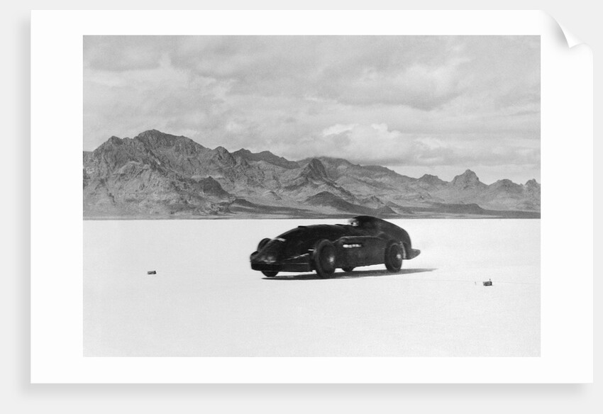 G.E.T. Eyston Breaking Speed Record in Automobile by Anonymous