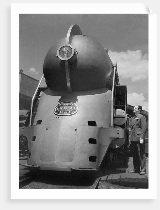 Inventor Standing by His Train Model by Anonymous