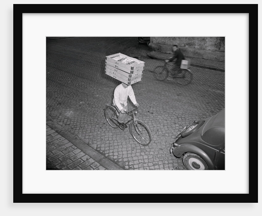 Delivery Boy Riding Bicycle with Box on Head by Anonymous