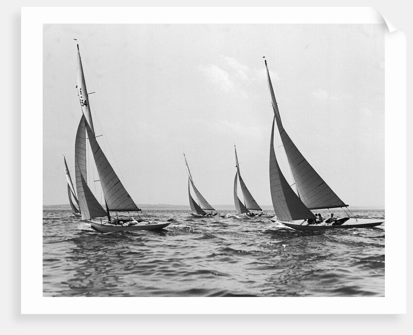 Six Meter Sailboats Leaning in Race by Anonymous