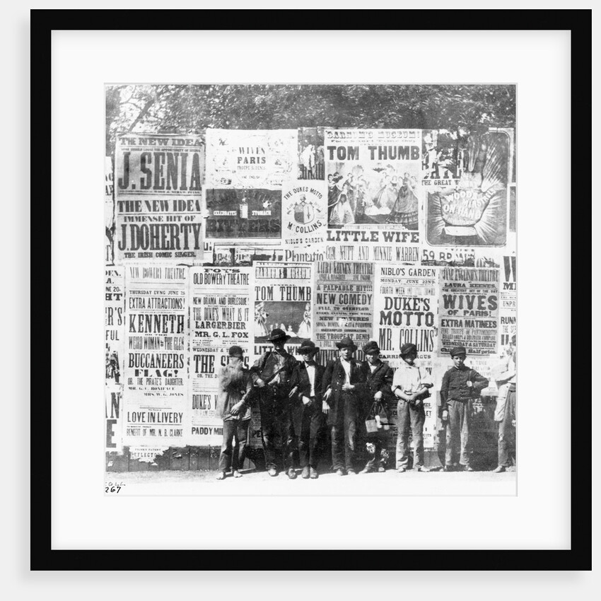 Boys Standing in Front of Posters by Anonymous