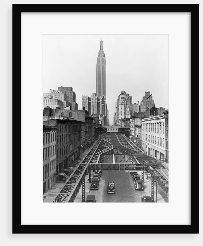 View of Empire State Building Beyond Elevated Train Tracks by Anonymous