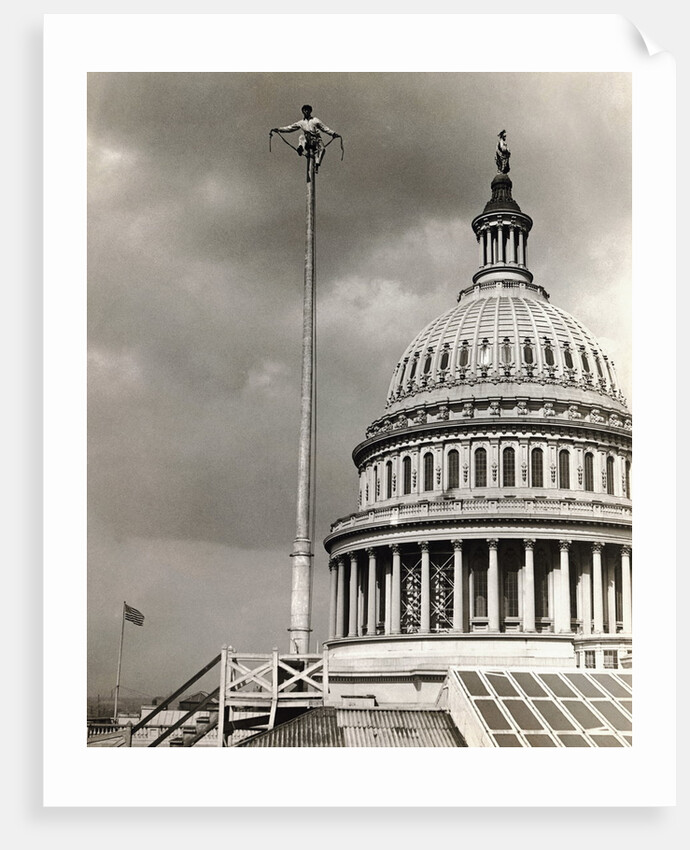Man Sitting Near Dome of Capitol by Anonymous