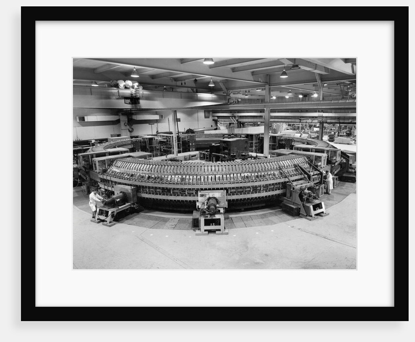 Technicians Near Circular Electronic Device by Anonymous