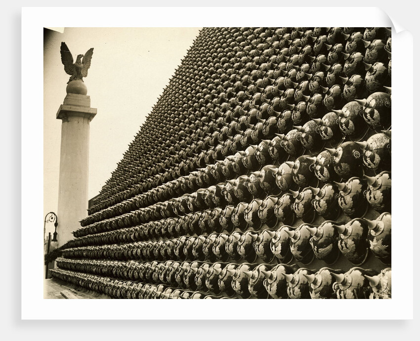 German Helmets Decorating Wall by Anonymous