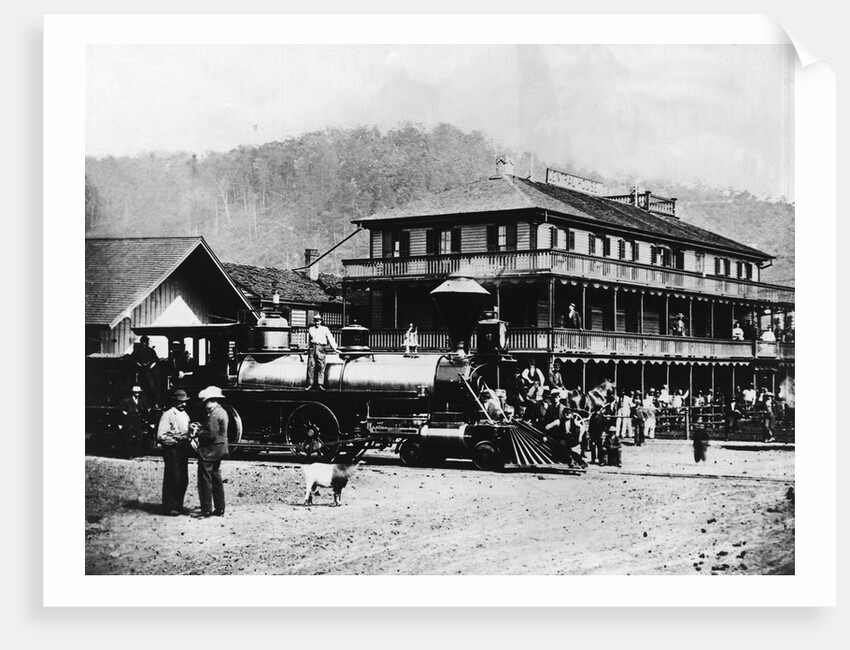 Railroad Passing Through Small Town by Anonymous