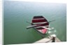 Rowing boat moored at the end of a jetty by Anonymous