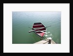 Rowing boat moored at the end of a jetty by Anonymous