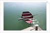 Rowing boat moored at the end of a jetty by Anonymous