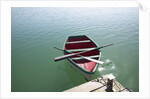 Rowing boat moored at the end of a jetty by Anonymous