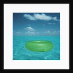 Inflatable rubber ring floating in the sea by Anonymous