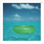 Inflatable rubber ring floating in the sea by Anonymous