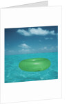 Inflatable rubber ring floating in the sea by Anonymous