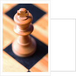 King chess piece on chessboard by Anonymous