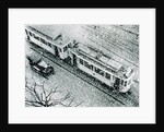 Urban traffic during snowfall, historic photo by Anonymous