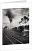 Freight train in front of smoking chimney stacks, nostalgia by Anonymous