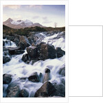 View of a river running over rocks by Anonymous