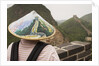 Tourist Wearing Illustrated Conical Hat on the Great Wall by Anonymous