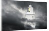 Lighthouse Emerging From Dark Clouds by Anonymous