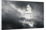 Lighthouse Emerging From Dark Clouds by Anonymous
