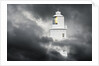 Lighthouse Emerging From Dark Clouds by Anonymous