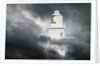 Lighthouse Emerging From Dark Clouds by Anonymous