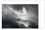 Lighthouse Emerging From Dark Clouds by Anonymous