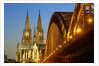 Cologne Cathedral and Hohenzollern Bridge on Rhine River by Anonymous