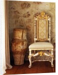 A pot is kept beside a chair against the wall in the house by Anonymous