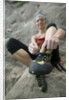 Woman Putting on Rock Climbing Shoes by Anonymous