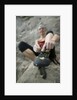Woman Putting on Rock Climbing Shoes by Anonymous