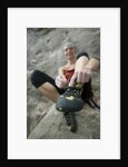 Woman Putting on Rock Climbing Shoes by Anonymous