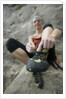 Woman Putting on Rock Climbing Shoes by Anonymous