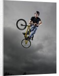BMX Biker Performing Tricks by Anonymous