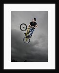 BMX Biker Performing Tricks by Anonymous