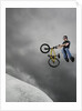 BMX Biker Performing Tricks by Anonymous