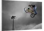 BMX Biker Performing Tricks by Anonymous