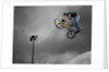 BMX Biker Performing Tricks by Anonymous