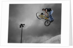 BMX Biker Performing Tricks by Anonymous