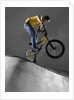 BMX Biker Performing Tricks by Anonymous