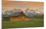 Log Barn in Meadow near Mountain Range by Corbis