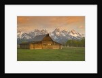 Log Barn in Meadow near Mountain Range by Corbis