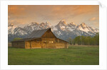 Log Barn in Meadow near Mountain Range by Corbis