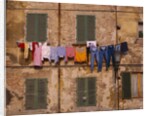 Laundry Hanging Outside Windows by Anonymous
