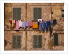 Laundry Hanging Outside Windows by Anonymous