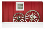 Wagon Wheels on Snow Against Stable by Anonymous