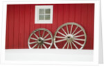 Wagon Wheels on Snow Against Stable by Anonymous
