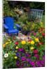 Backyard Flower Garden With Chair by Anonymous