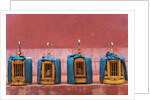 Wooden Bird Cages Against Ancient City Wall by Anonymous