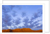 Cumulus Clouds Over Sandstone Buttes at Sunrise by Anonymous